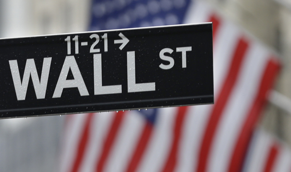 This July 9, 2015 photo shows a Wall Street sign near the New York Stock Exchange in New York (AP photo)
